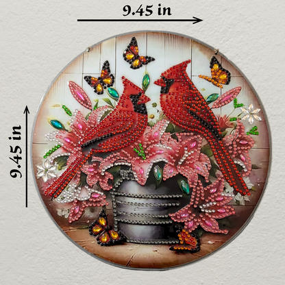 Circular decorative piece with red cardinals, pink flowers, and butterflies on a wooden background, with measurements indicated.